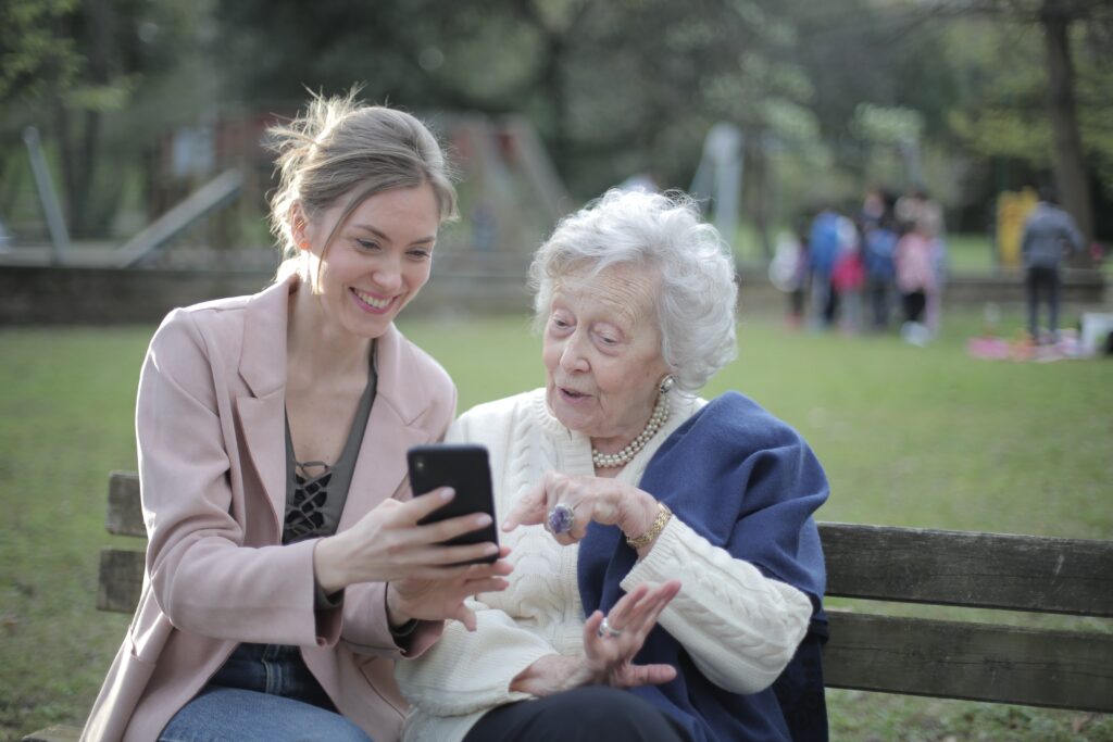 A woman trying to get her mother to recognize a picture