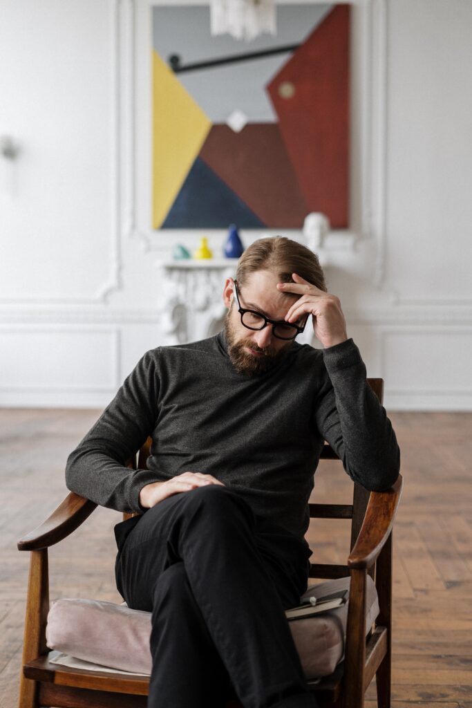 mental health - a guy in a chair thinking