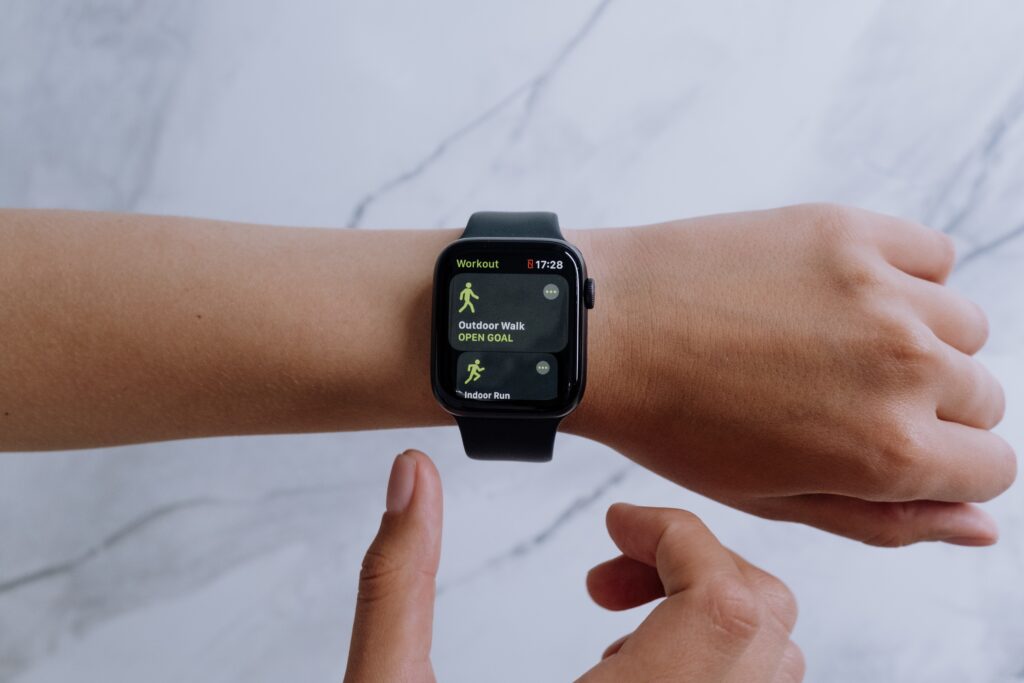 Digital Health - Someone fixing their fitbit watch.