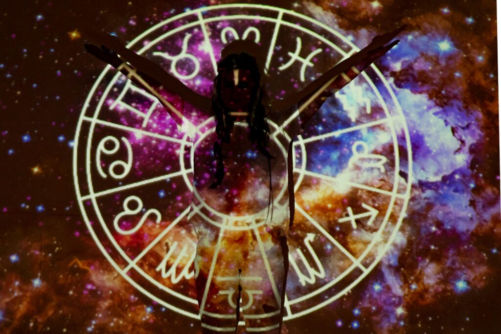 Holistic Health - A picture of a holistic man with astrology chart behind him.