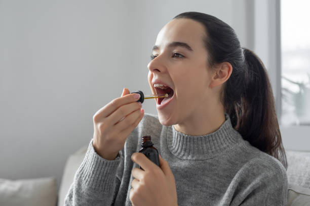 Woman using CBD oil
